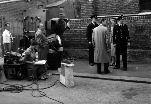 Connie Willis (seated, left) working as continuity ‘girl’ on the set of THE MAN WHO KNEW TOO MUCH (1956), directed by Alfred Hitchcock (standing next to the camera) and co-starring Doris Day (standing, right). Photo courtesy of The Cinema Museum.